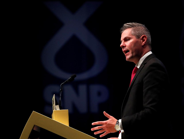 scotland s finance minister quits over messages to minor