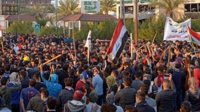 watch iraq protesters defiant as they bury at least 8 killed in overnight clash