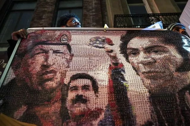 protestors rally in support of venezuelan president nicolas maduro as they hold a banner featuring the late former president of venezuela hugo chavez the current president of venezuela nicolas maduro and 19th century venezuelan military and political leader simon bolivar outside the venezuelan consulate in midtown manhattan photo afp protestors rally in support of venezuelan president nicolas maduro as they hold a banner featuring the late former president of venezuela hugo chavez the current president of venezuela nicolas maduro and 19th century venezuelan military and political leader simon bolivar outside the venezuelan consulate in midtown manhattan photo afp