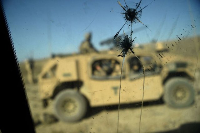 s army soldiers from nato are seen through a cracked window of an armed vehicle in a checkpoint during a patrol against islamic state militants at the deh bala district in the eastern province of nangarhar province photo afp