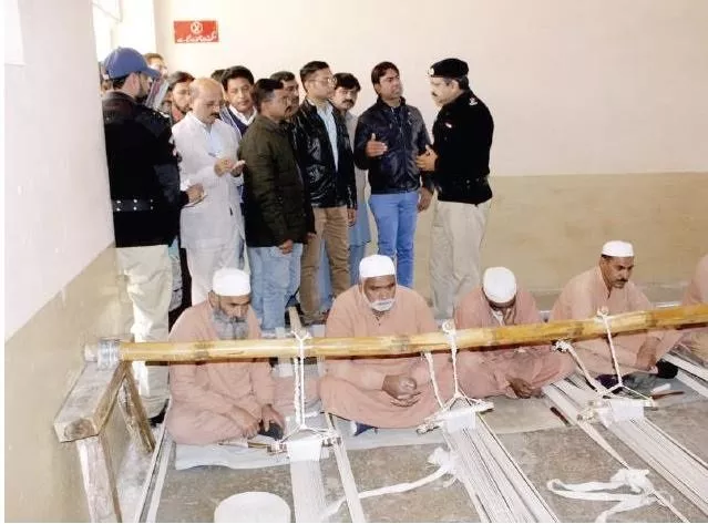 a jail official briefs reporters about items produced by inmates in jail factory photo express a jail official briefs reporters about items produced by inmates in jail factory photo express
