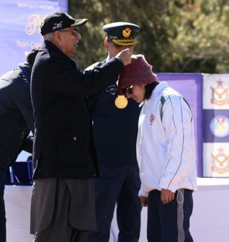president alvi awarding medal to pakistani skier khushim sahiba during the prize distribution photo app president alvi awarding medal to pakistani skier khushim sahiba during the prize distribution photo app
