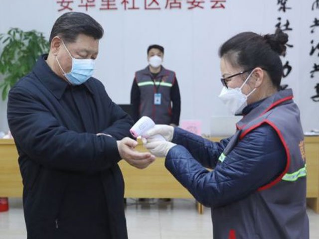 the chinese president donned a face mask and had his temperature checked while visiting medical workers and patients photo courtesy bbc epa