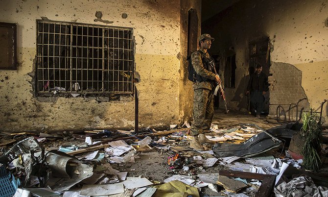 an army soldier stands inside the army public school which was attacked by taliban gunmen in peshawar photo reuters