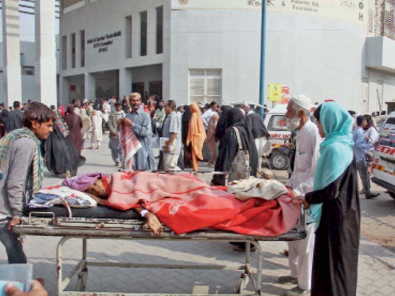 a patient lies on a stretcher outside jpmc as doctors at the hospital went on strike for two hours on thursday photo online