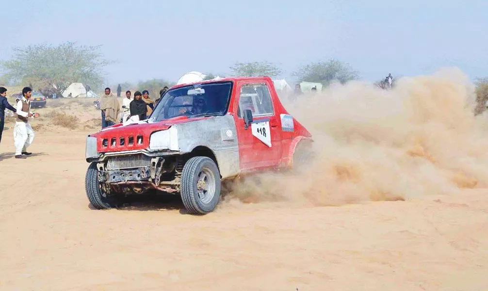 a contestant drives through sand during the cholistan jeep rally photo inp a contestant drives through sand during the cholistan jeep rally photo inp