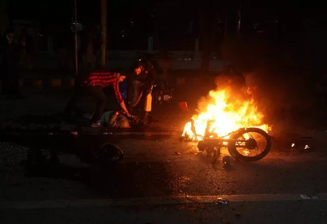 people check the condition of a victim after a blast in lahore pakistan february 13 2017 photo file people check the condition of a victim after a blast in lahore pakistan february 13 2017 photo file