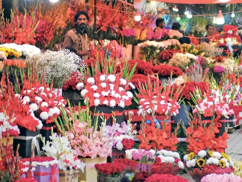 a florist displays flowers ahead of valentine s day at jinnah super market in the federal capital photo online