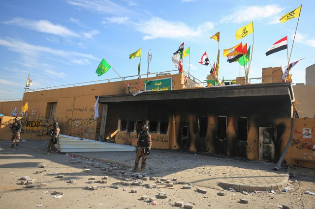 iraqi security forces stand guard in front the us embassy in the capital baghdad on january 1 2020 photo afp