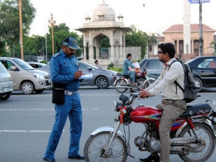 a helmetless biker given a challan photo inp file
