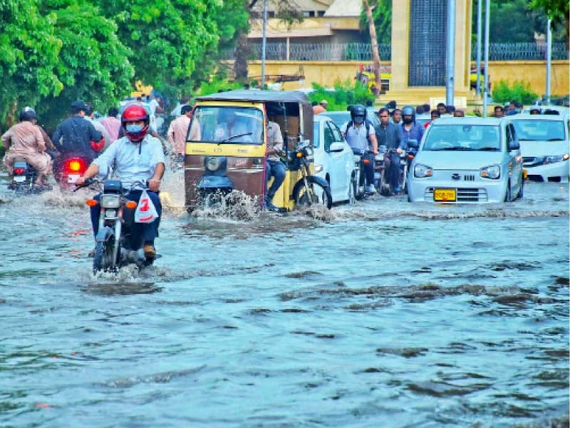 motorists struggle to ride through flooded streets in saddar once again after the latest spell of monsoon rains lashed the city on thursday the downpour is expected to continue until saturday photo inp