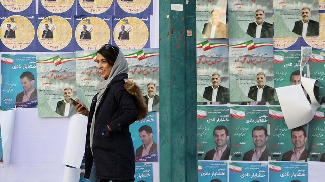 the elections have been overshadowed by mass disqualifications of over 7 000 mainly moderate and reformist candidates by the guardian council oversight body photo afp