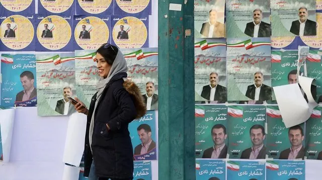 the elections have been overshadowed by mass disqualifications of over 7 000 mainly moderate and reformist candidates by the guardian council oversight body photo afp
