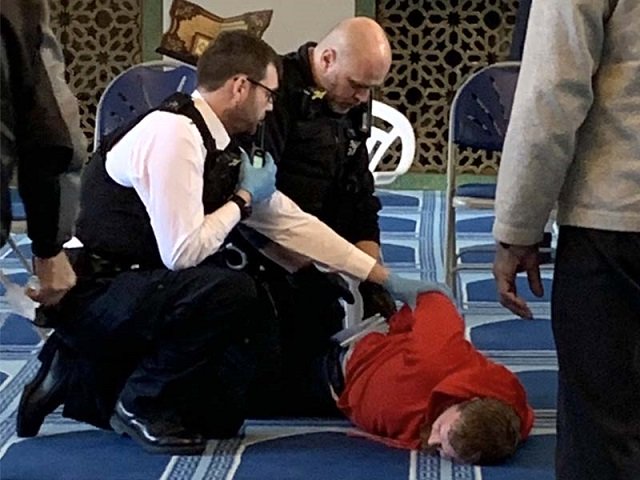 pictures on social media show police officers restraining a man in the prayer hall of the mosque near regents park photo twitter murshhabib