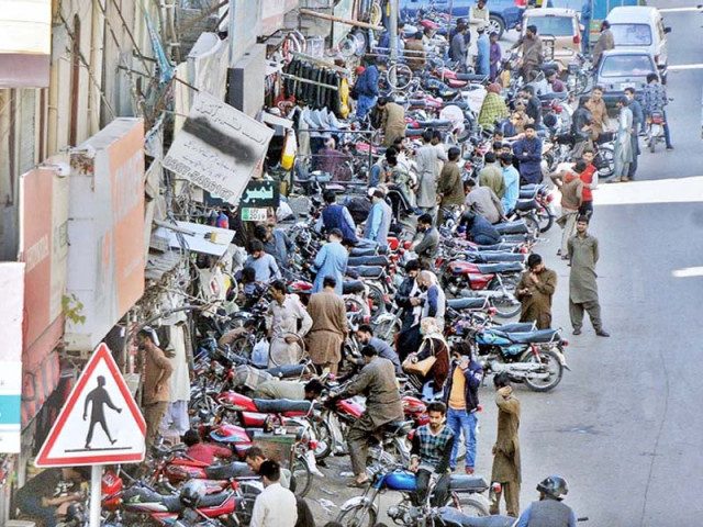 parking two wheelers on sidewalks is a common practice in rawalpindi s commercial areas which forces pedestrians to risk their lives by walking on busy thoroughfares photo nni parking two wheelers on sidewalks is a common practice in rawalpindi s commercial areas which forces pedestrians to risk their lives by walking on busy thoroughfares photo nni