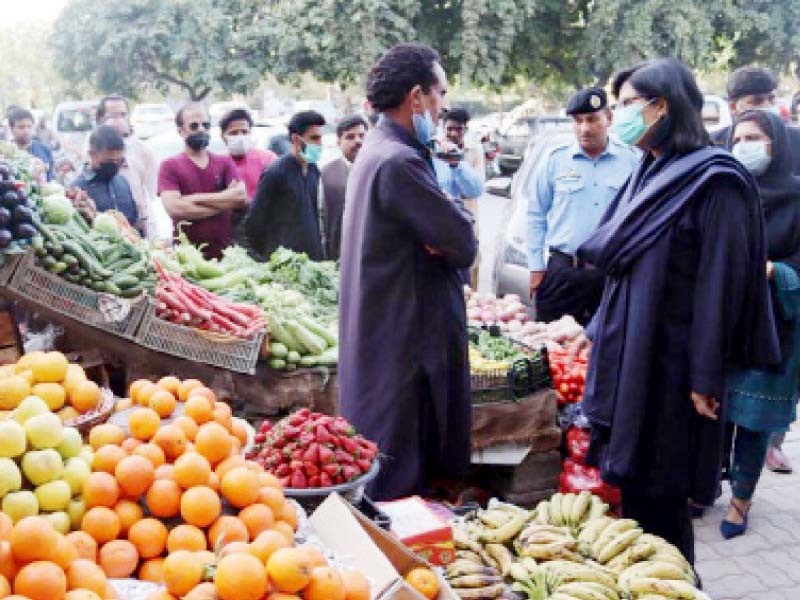 special assistant to prime minister on poverty alleviation and social safety dr sania nishtar speaks to street vendors in the sector g 11 markaz area of the federal capital photo twitter