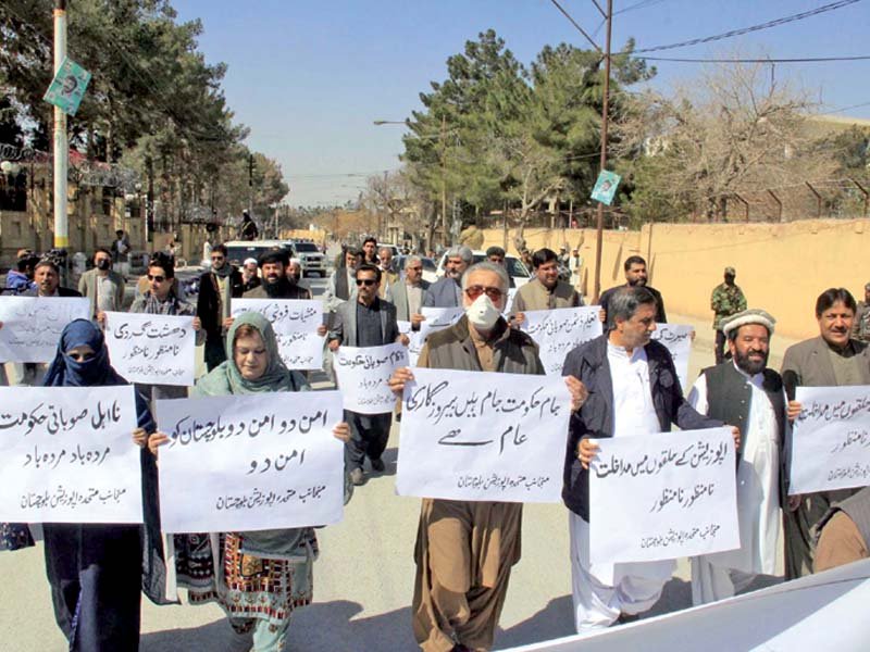 members of united opposition balochistan hold anti government placards near the provincial secretariat in quetta photo ppi