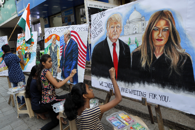 children from an art school make paintings of us president donald trump ahead of his india visit photo afp