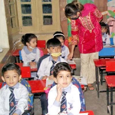 children attend a class at a government school photo online