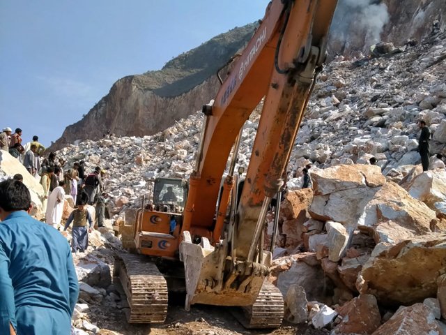 rescue efforts under way to recover several labourers still trapped under the rubble photo express