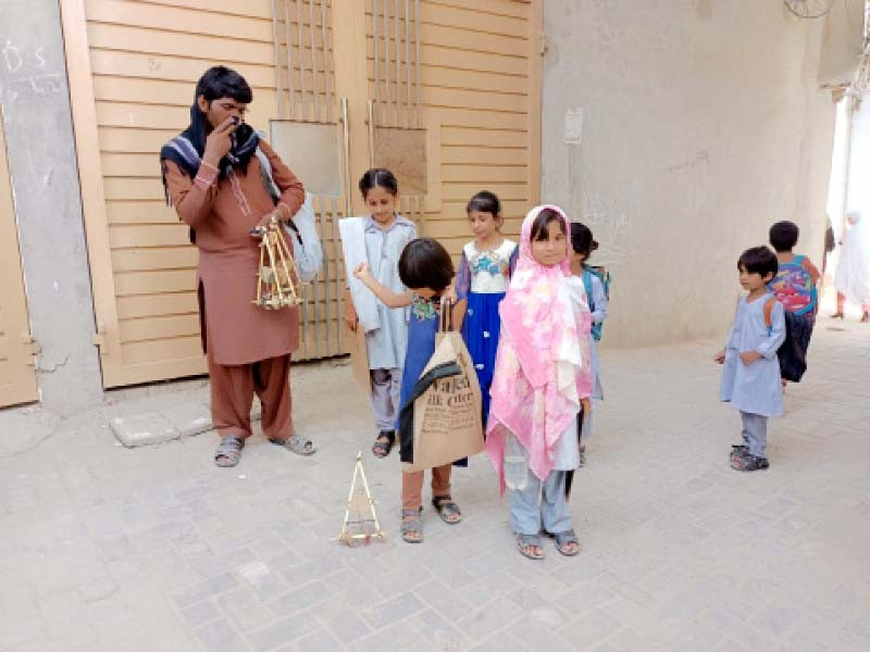 despite losing two of his children due to poor healthcare in lodhran the dragging drum car maker continues to entertain other children with his unique musical toys photos express