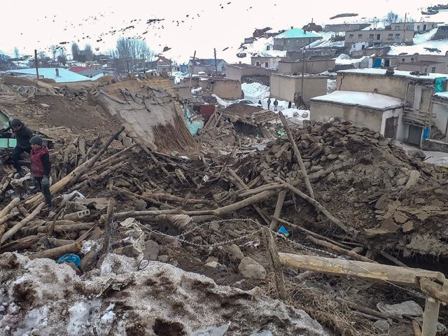 people walk amongst the rubbles in baskale in van province turkey after a magnitude 5 7 earthquake in northwestern iran killed at least nine people photo afp people walk amongst the rubbles in baskale in van province turkey after a magnitude 5 7 earthquake in northwestern iran killed at least nine people photo afp