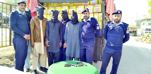police with suspects who had stolen a truck loaded with cooking oil photo express police with suspects who had stolen a truck loaded with cooking oil photo express