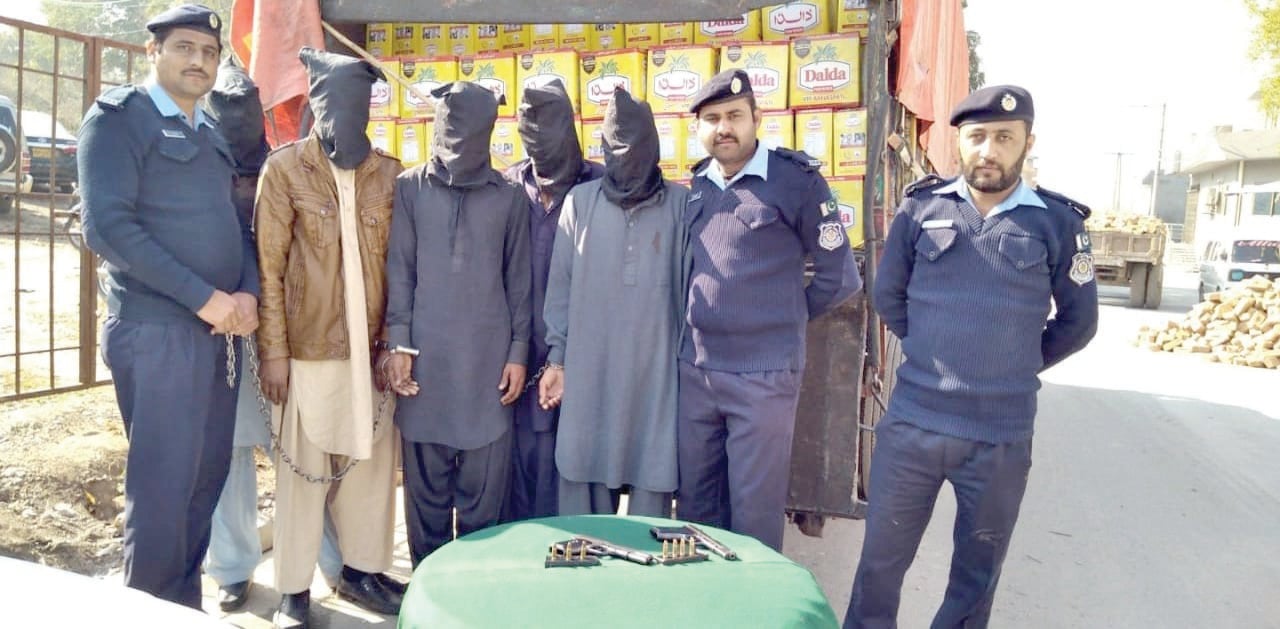 police with suspects who had stolen a truck loaded with cooking oil photo express