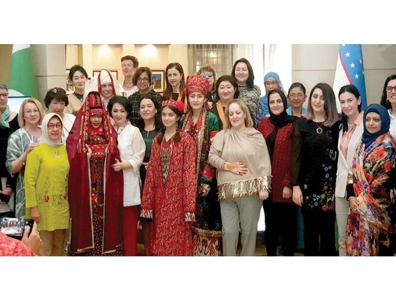 wives of diplomats wearing traditional uzbek dresses during exhibition photo dna