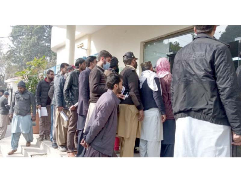 parents submit petitions at cantonment board offices on monday against the closure of private schools in rawalpindi photo express