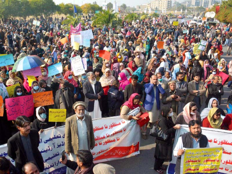 teachers hold a protest with placards and banners as they rally for their demands to be met at d chowk in islamabad photo inp