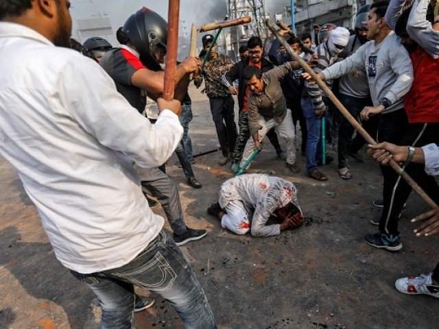 people supporting the new citizenship law beat a muslim man during a clash with those opposing the law in new delhi photo reuters