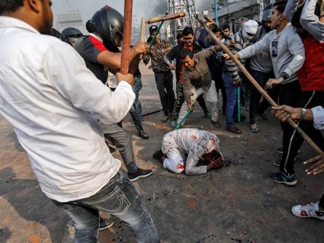 people supporting the new citizenship law beat a muslim man during a clash with those opposing the law in new delhi photo reuters people supporting the new citizenship law beat a muslim man during a clash with those opposing the law in new delhi photo reuters