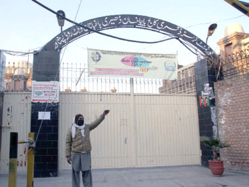 a guard stands outside the closed girls degree college in peshawar photo app
