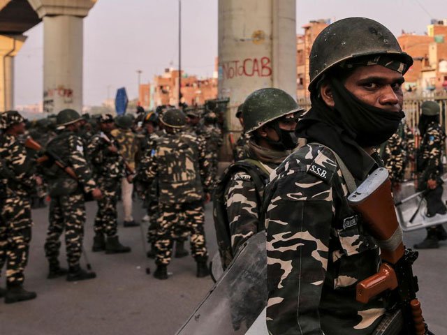 paramilitary troops patrol in a riot affected area after clashes erupted between people demonstrating for and against a new citizenship law in new delhi india february 25 2020 photo reuters