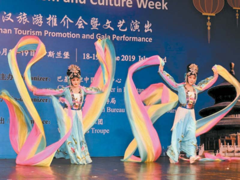 a chinese troupe presents a traditional folk dance in an event organis ed by the china cultural centre in pakistan photo express