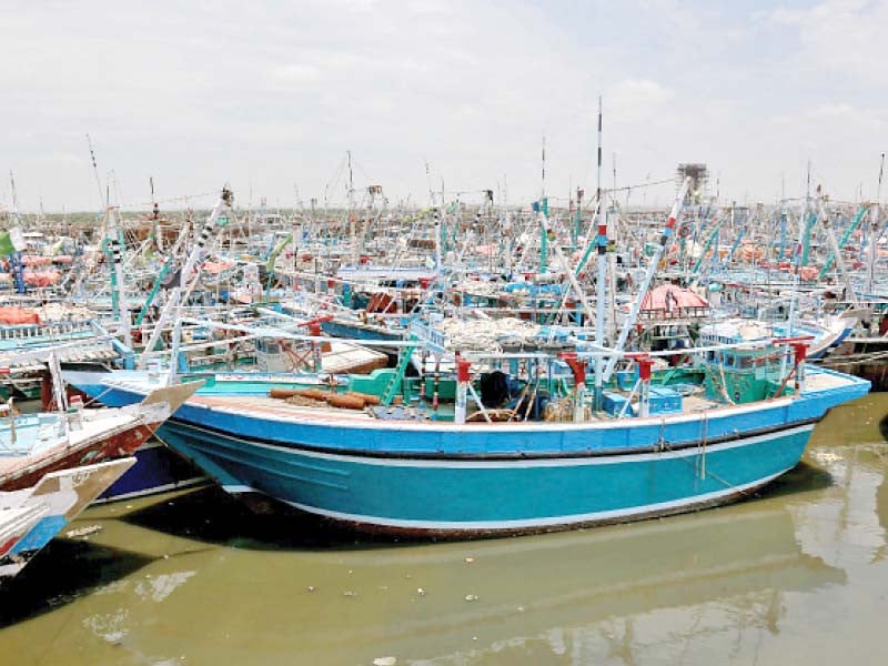boats are moored at keamari jetty as fishermen were advised against going into the sea due to a storm warning photo jalal qureshi express