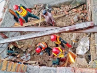 rescue workers cut through rebar in an attempt to extricate the victims of a roof collapse in lahore photo online file