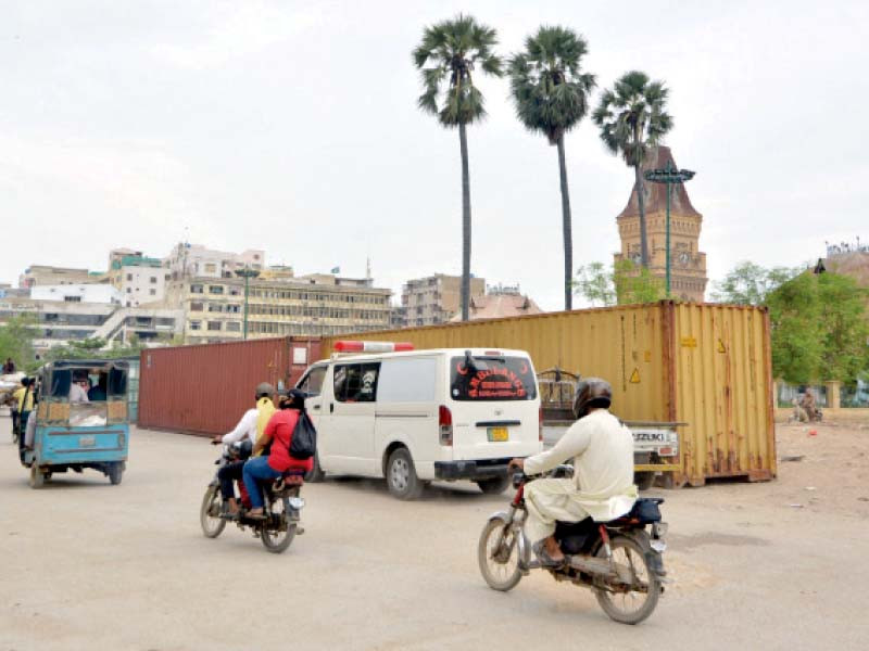 city authorities have brought containers to block selected roads along the routes of the muharram processions photo jalal qureshi express