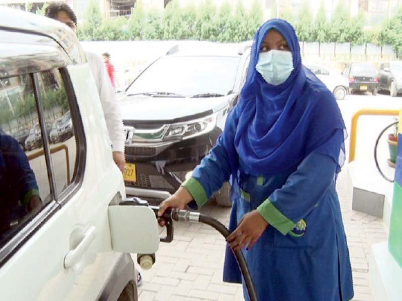 saman ayub 24 fuels up a car at a filling station in the clifton area of karachi photo express file