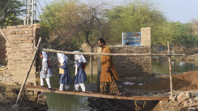 floods sweep future from schoolchildren floods sweep future from schoolchildren