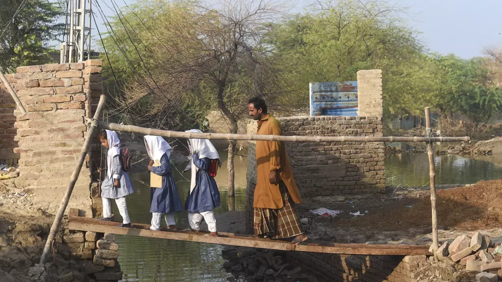 floods sweep future from schoolchildren floods sweep future from schoolchildren
