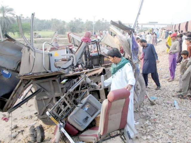 bystanders look at wrecked parts of the bus that was hit by a train while trying to cross the tracks at least 19 passengers were killed in the collision photo afp bystanders look at wrecked parts of the bus that was hit by a train while trying to cross the tracks at least 19 passengers were killed in the collision photo afp