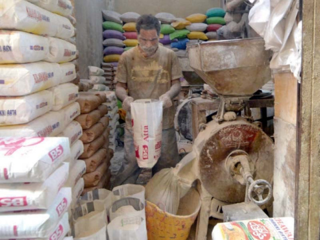 a worker grinds wheat at a shop in the saddar area of karachi to make whole grain flour photo jalal qureshi express a worker grinds wheat at a shop in the saddar area of karachi to make whole grain flour photo jalal qureshi express