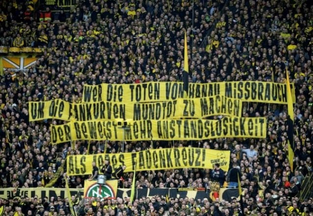 stadium announcers in dortmund and berlin threatened calling the games off unless the banners were removed photo afp stadium announcers in dortmund and berlin threatened calling the games off unless the banners were removed photo afp
