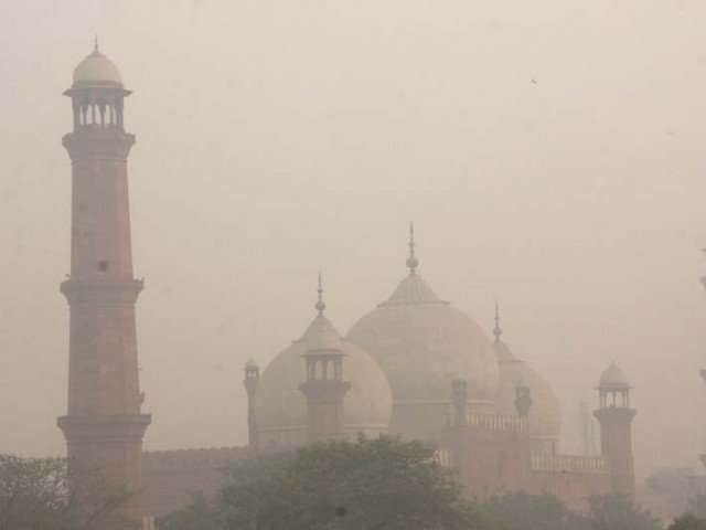 smog hangs in the air around badshahi mosque in lahore photo express file