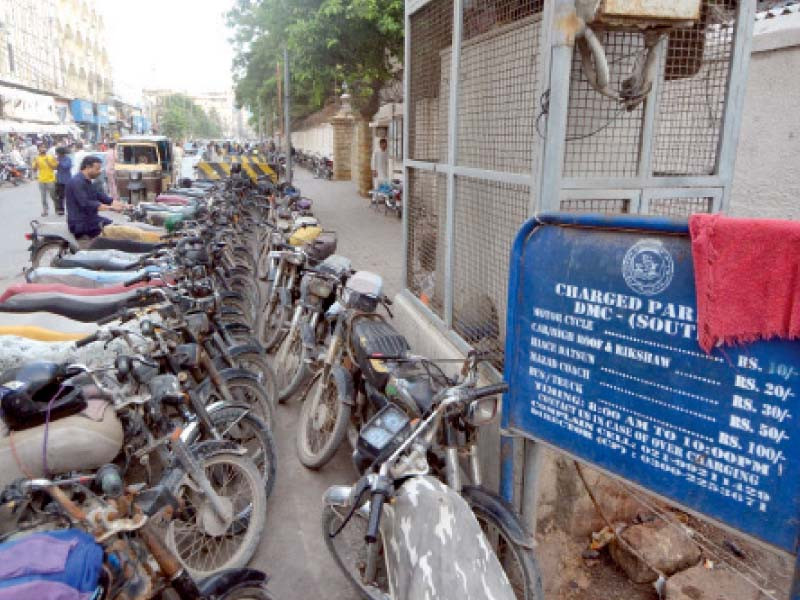 rates of charged parking displayed on the official board placed in the busy saddar bazaar are not followed by the contractors photo jalal qureshi express