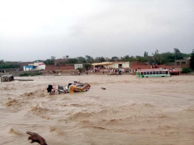 a view of buses swept away by hill torrents in dera ghazi khan photo express a view of buses swept away by hill torrents in dera ghazi khan photo express