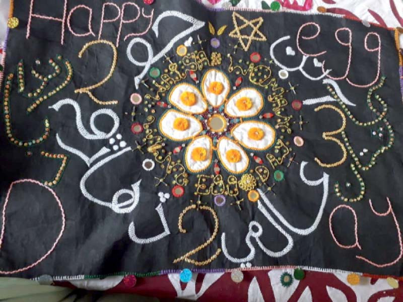 embroidery by a village woman shows message for consuming eggs daily photo express