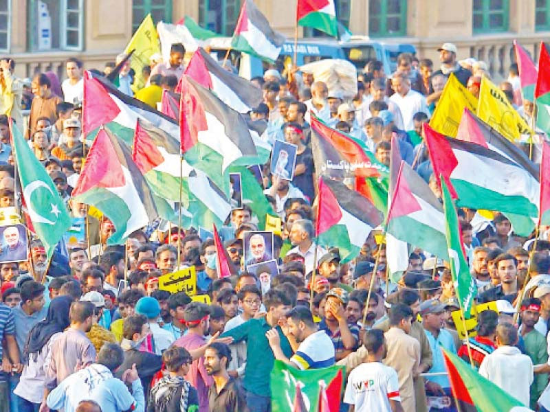 protestors waving palestinian flags head towards the us consulate in karachi during a march organised by the majlis wahdatul muslimeen photo express